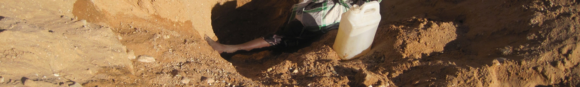 Somalilander Digging For Water In A Wadi